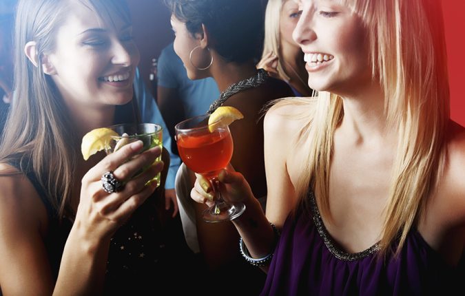 Portrait of multi ethnic friends having cocktail at a party