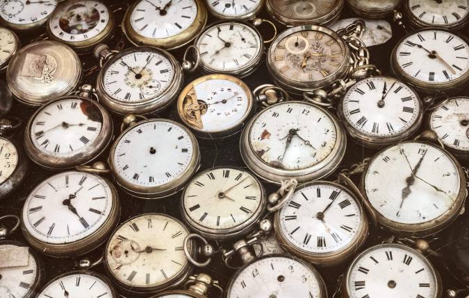 Retro styled image of old scratched and run down pocket watches